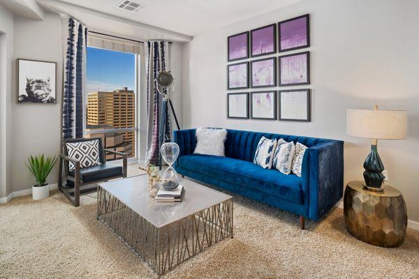 Living area with Denver skyline view.