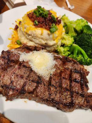 Ribeye with loaded mashed potatoes and broccoli.