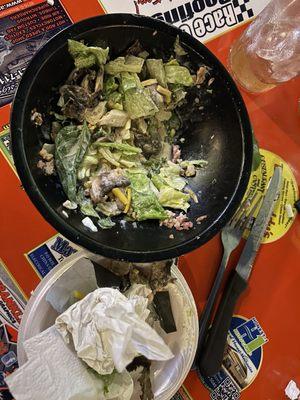 The leftover lettuce that was left in the bowl.