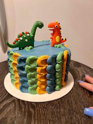 Marble smash cake with buttercream frosting Dino style