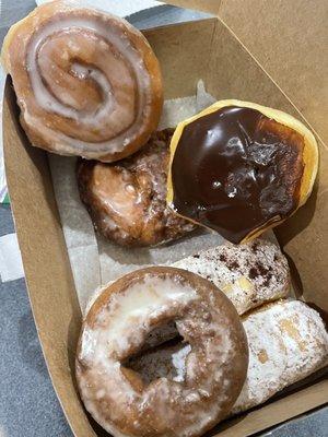 Cinnamon roll, apple fritter, cream donuts, and sour cream