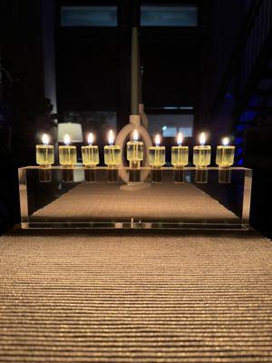 Menorah made from lucite with oil lights.