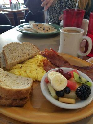 Breakfast on 1-7-18 2 eggs, toast, bacon, fruit ($7) , coffee (1.50) And 3 blueberry pancakes ($7?) So fantastic !