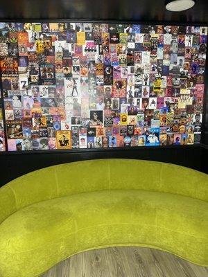 Couch and collage in the entrance