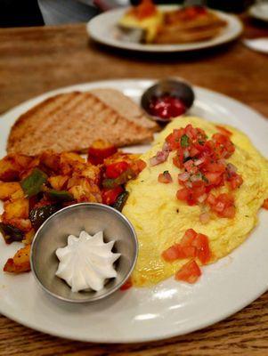 Oxaca omelette with home fries + toast. Delicious and filling !