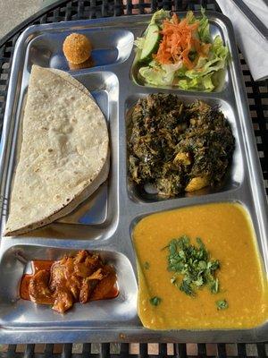 Thali with aloo palak, dal, and roti (and salad, mango pickle, and dessert). Delicious.