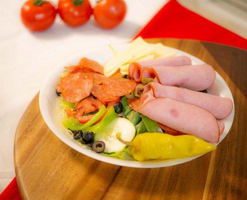 Antipasto Salad: Pepperoni, Ham, Provolone and Provolone on top our garden salad.