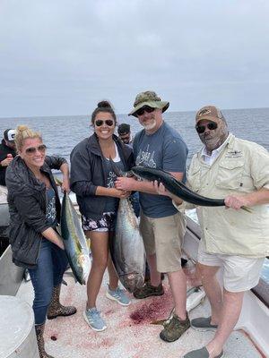 Two yellowtail and one blue fin tuna.