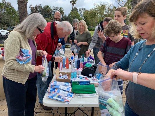 Church preparing "Manna Bags" to distribute to homeless in OC.