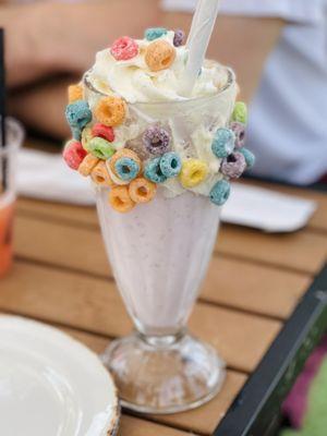 Strawberry  milkshake decorated with fruit loops