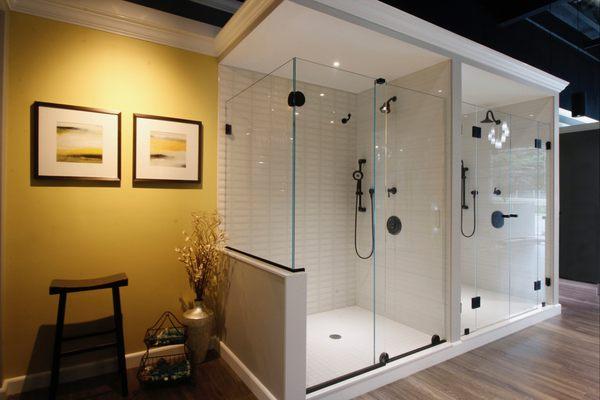 Oasis shower doors has both sliding and hinged shower door solutions on display.