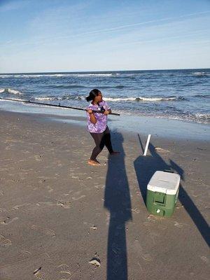 14 year old fishing with new fishing pole.