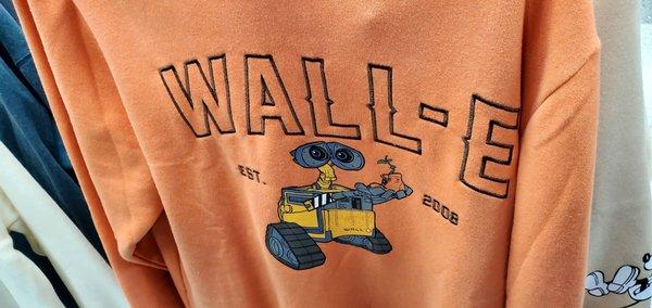 An orange Wall-E sweatshirt.