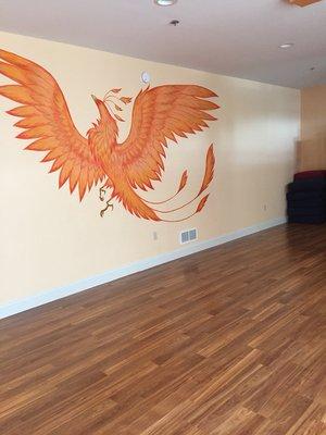 The Phoenix rises on the wall of our peaceful yoga studio