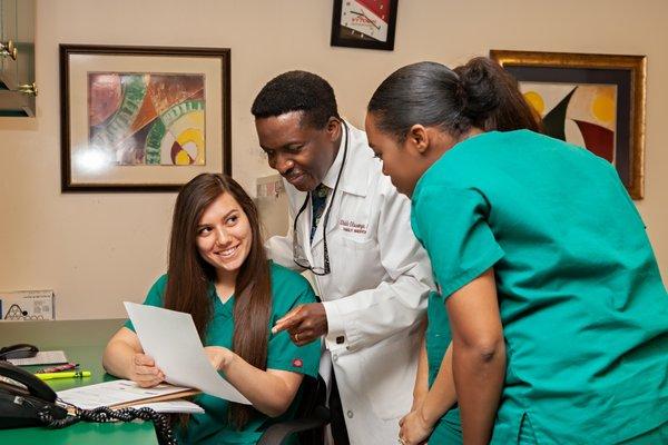 Randi Woolwine, Office Manager discussing Allergy result with Physician and Medical Assistant. Destiny Berkely