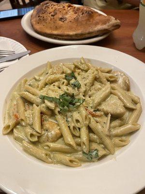 Chicken pesto penne  Italiano Calzone (background)