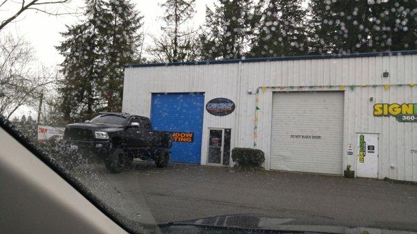 Small shop hidden behind a 2 story building. They do great work and are extremely professional and friendly.