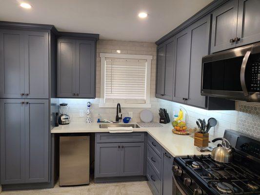 Blue Gray Color Cabinets w/ White Quartz Countertop.