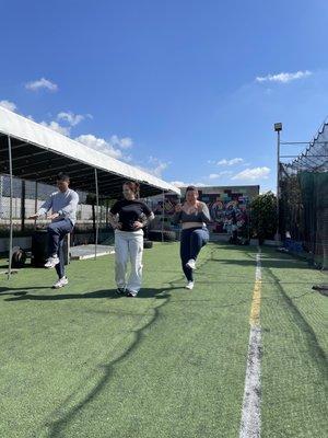 Coach Harley warming up her personal training clients.