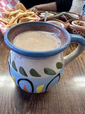 Champurrado!! Mexican version of hot chocolate. Really good surprise! Careful, it's served super hot.