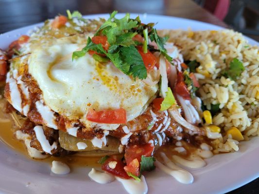 West Texas Stacked Brisket Enchiladas with an egg on top - DELICIOUS