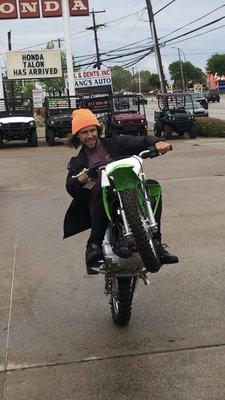 SX racer Scott Champion stunting on his new Kawasaki 110 at Progressive Powersports of Arlington