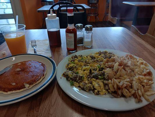 Ground beef scramble and country potatoes. A pancake and oj