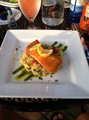 Pan seared Atlantic Salmon. That's pesto lining the bottom and orzo in the middle. Perfection!