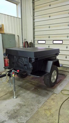 Customer brought in his little army trailer to be Rynolined and his aluminum lid and fenders flat blacked...