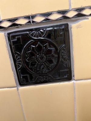 Close up of the replacement tiles. Yes the one next to it chipped as the tile man was removing the broken tile.