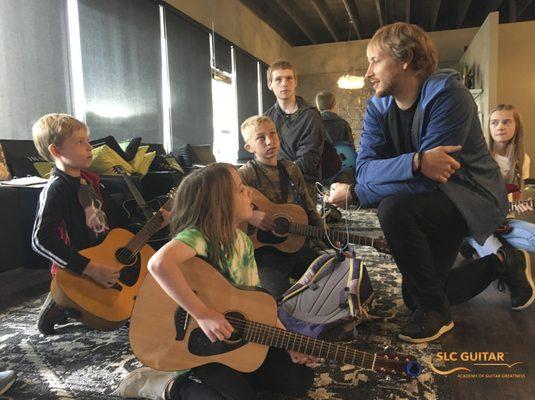 SLC Guitar Preston (owner) with kids