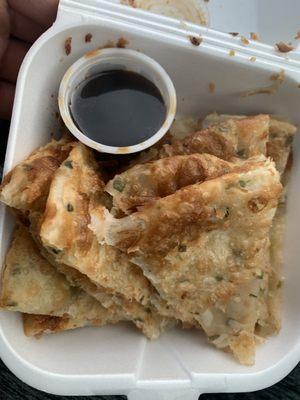 Order of scallion pancakes to go.  Our favorite appetizer on the menu!!!  So crispy and delicious with a super flavorful dipping sauce!!!!!