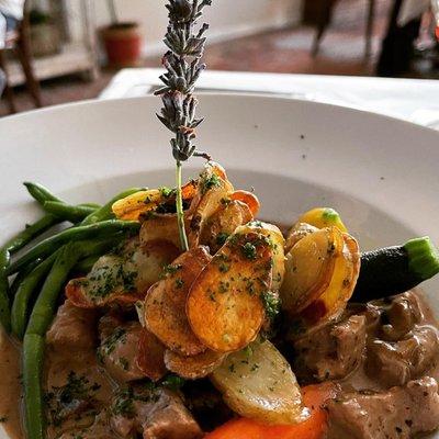 Veal with a delicious mushroom sauce that you will want to dip your bread in