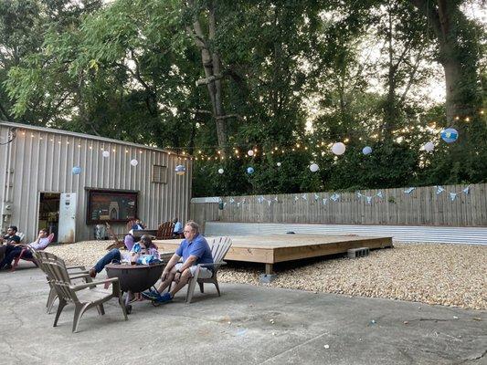 String lights and Adirondack chairs