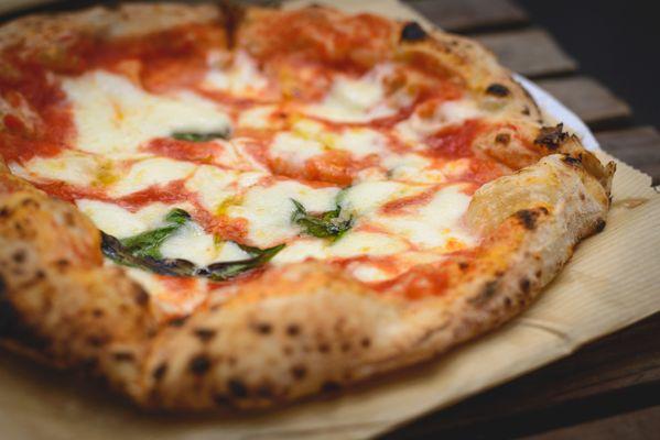 Hand-tossed Neapolitan pizza we make in our cafe