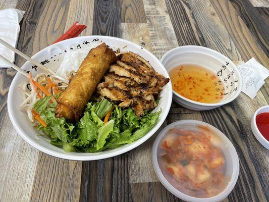 Chicken vermicelli bowl with and egg roll and a side of kimchi.   Fantastic.