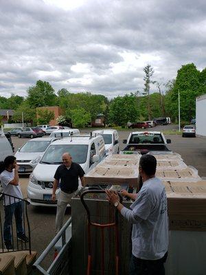 Loading up new washers at the shop to be installed!