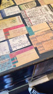 Lots of old concert tickets under the counter - the owner actually went to all these shows!