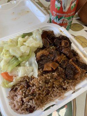 Oxtails with cabbage and rice & peas