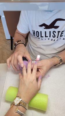 Nails with Tommy... I trust him to pick out my color. He chose Passion Plum.