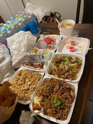 Left to right: combination fried rice, garlic chicken with noodles, chicken satay, pad se ew with chicken, and wonton soup.