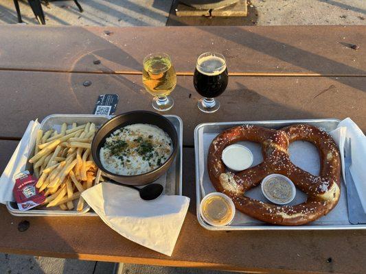 Mac and cheese, fries, and Nordic Knot pretzel, a cider and stout