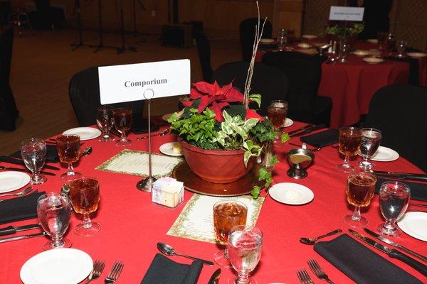 Our beautiful table settings at the Holiday Gala. Floral arrangements were donated by Lowe's- Lake Wylie. Comporium was gold sponsor.