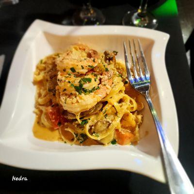 Cajun Chicken and Shrimp Jambalaya​  Turkey andouille sausage jambalaya over fettuccine