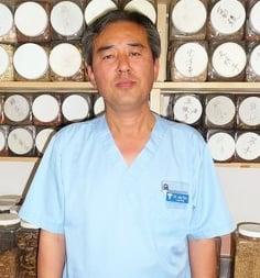 Dr Ryu pictured with some of the raw herbs he processes for herbal medication