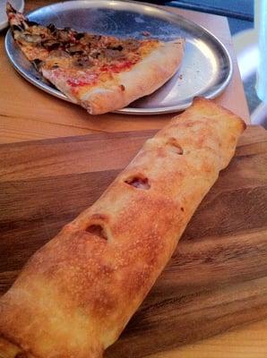 Stromboli and a slice of sausage and mushroom