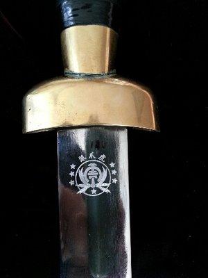 sword engraved with insignia