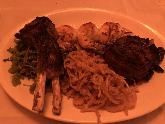 Trio special. Lamb, grilled shrimp and bacon wrapped filet.