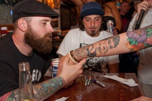 Andy Regan from Hourglass judging the Inked Magazine Tattoo Contest