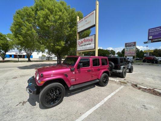 My Jeep looking pretty in front of Cartunes with its new Bestop Sunrider